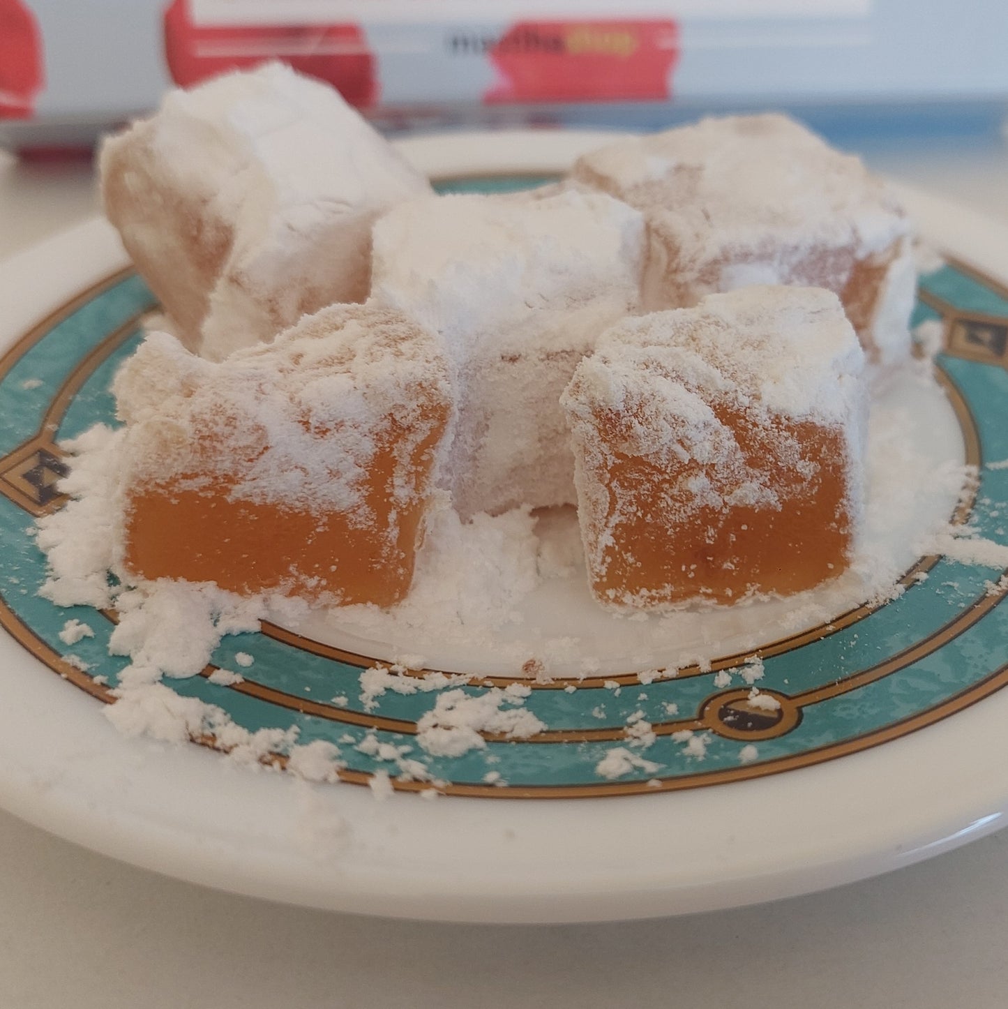Close-up of soft Greek rose petal loukoumi with powdered sugar